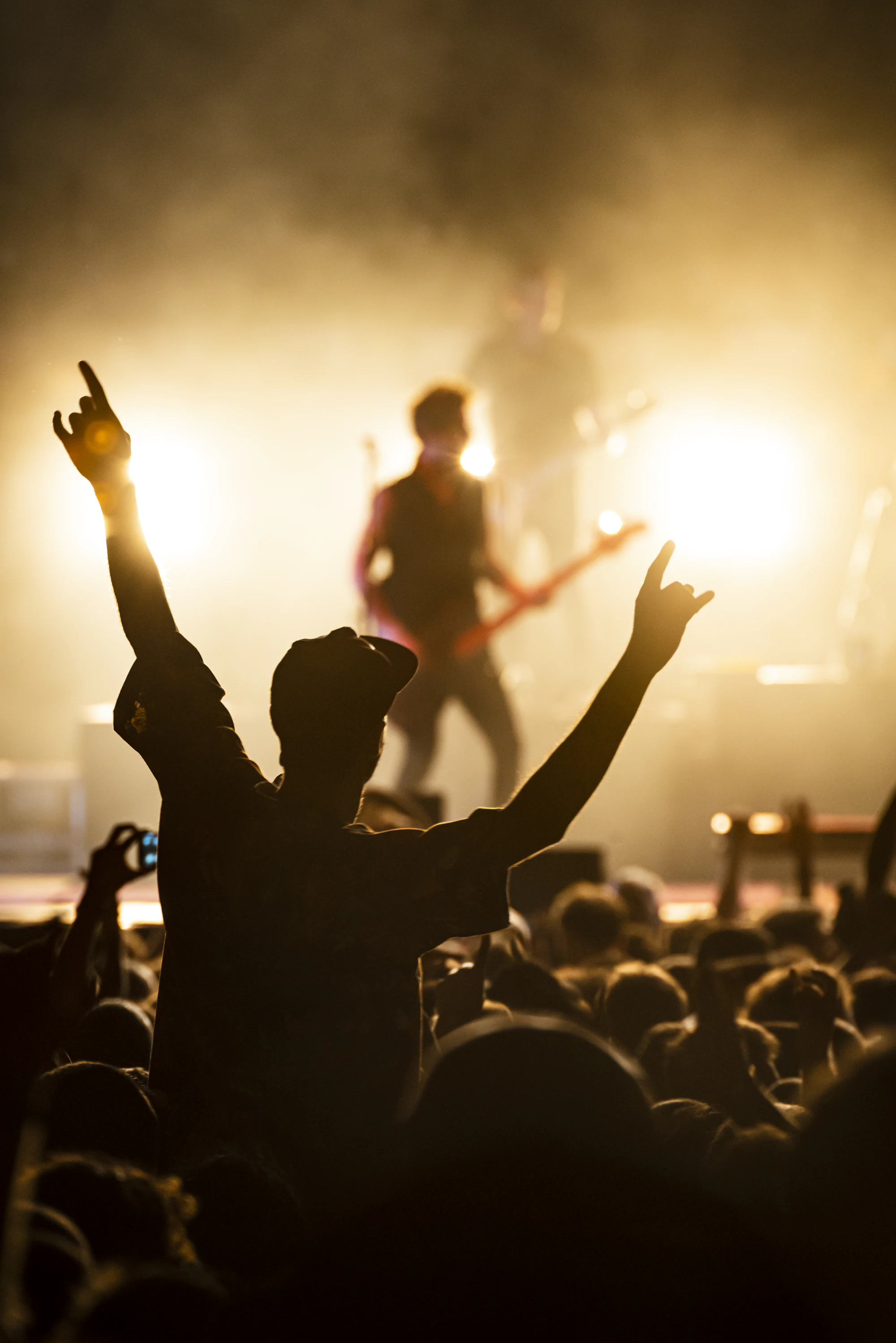 A band performing on a lit stage