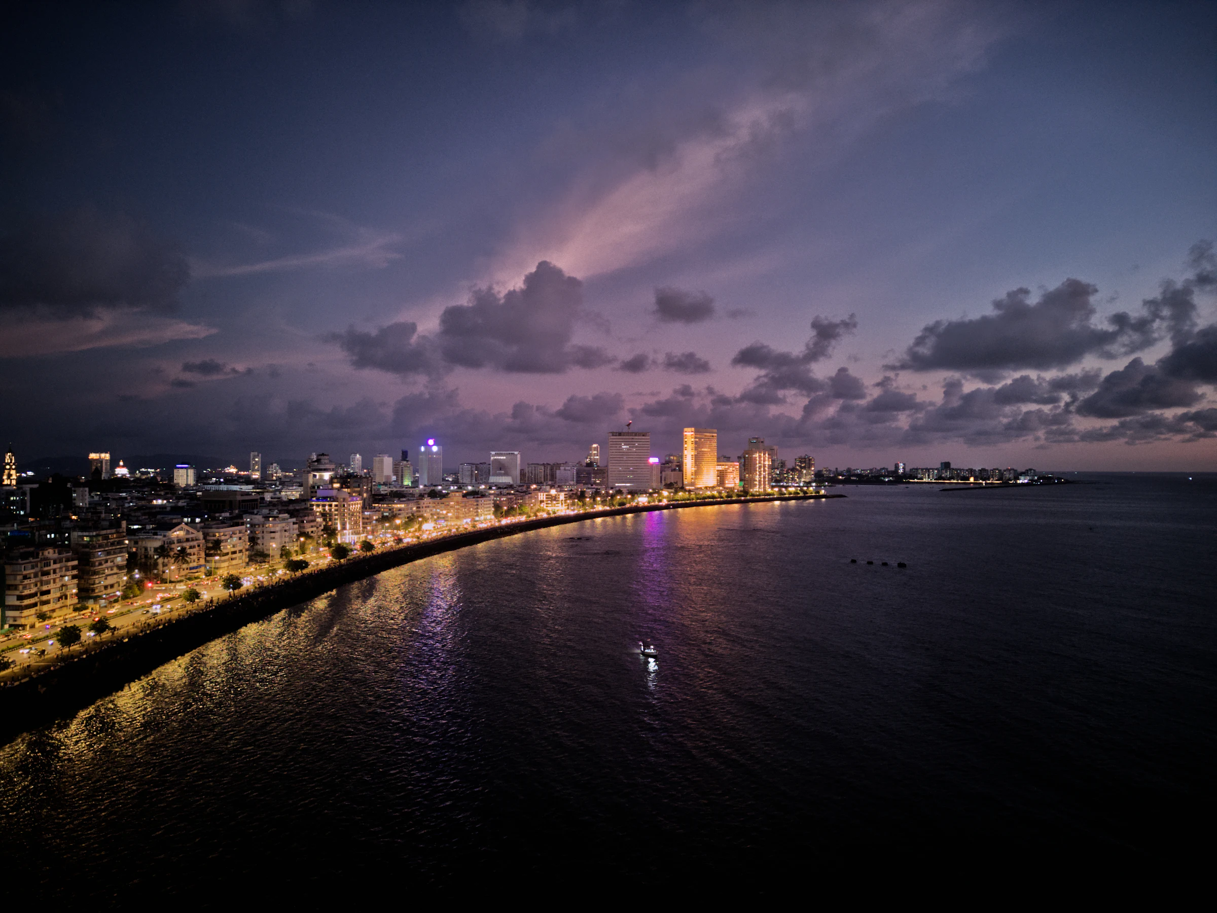 Mumbai's Marine Drive glittering along the bay at night